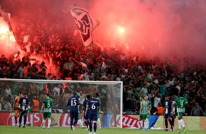  Fans with flare are seen in the stands during Maccabi Haifa vs Paris St Germain at Sammy Ofer Stadium, Haifa, Israel (credit: REUTERS/NIR ELIAS)