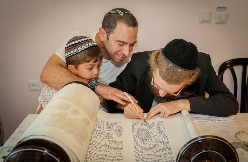  ‘I REALIZED that if my sons were ever going to find their way back to Torah, it wasn’t going to be by being rejected’: Celebrating a new Torah scroll (Illustrative). (credit: GERSHON ELINSON/FLASH90)