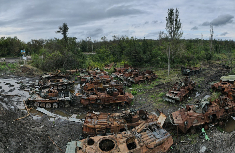 Russian tanks and armoured personnel carriers destroyed during a counteroffensive operation of the Ukrainian armed forces, amid Russia's attack on Ukraine, are seen near the town of Izium in Kharkiv region, Ukraine, September 14, 2022. (photo credit: IRYNA RYBAKOVA/UKRAINIAN ARMED FORCES/HANDOUT VIA REUTERS)