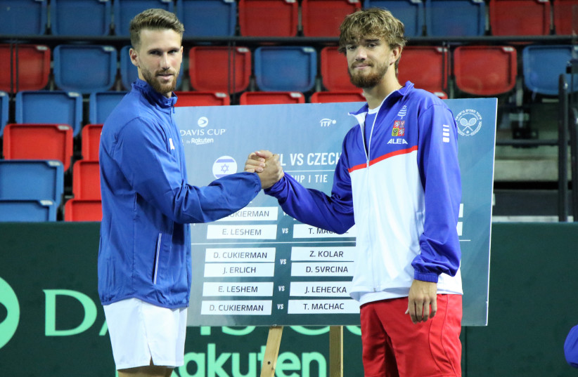 Israeli No. 1 Edan Leshem (left) shake hands with Czech Republic's No. 2, Tomas Machac, in September 15 2022, prior to their Davis Cup clash. (photo credit: ORI LEWIS)