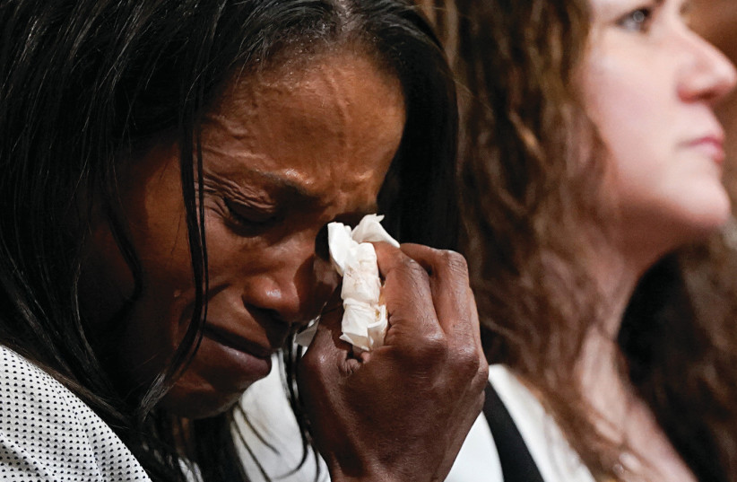  THE WIDOW of a Capitol Police officer cries at a congressional hearing this past June probing the Jan. 6 riots, in Washington. The book addresses the painful journey of widowhood. (photo credit: Elizabeth Frantz/Reuters)