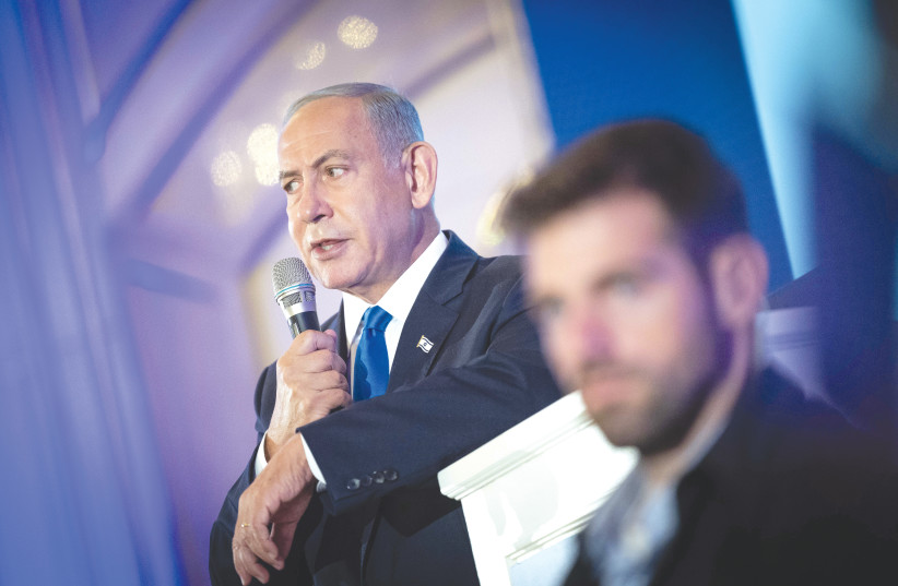  Head of the Likud Party Benjamin Netanyahu speaks at a conference at the Waldorf Astoria Hotel in Jerusalem this week. (credit: YONATAN SINDEL/FLASH90)