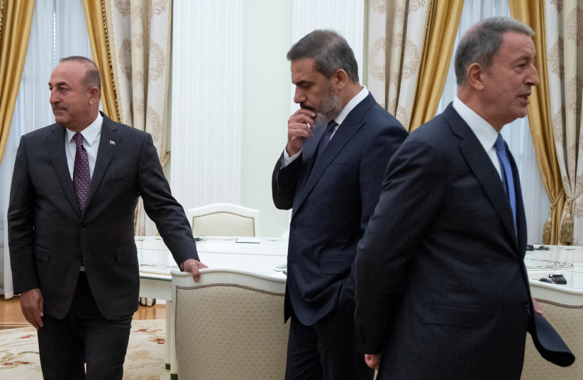 Turkish Foreign Minister Mevlut Cavusoglu, Defence Minister Hulusi Akar and intelligence chief Hakan Fidan are seen before a meeting with Russian President Vladimir Putin in the Kremlin in Moscow, Russia, August 24, 2018. (credit: Alexander Zemlianichenko/Pool via REUTERS/File Photo)