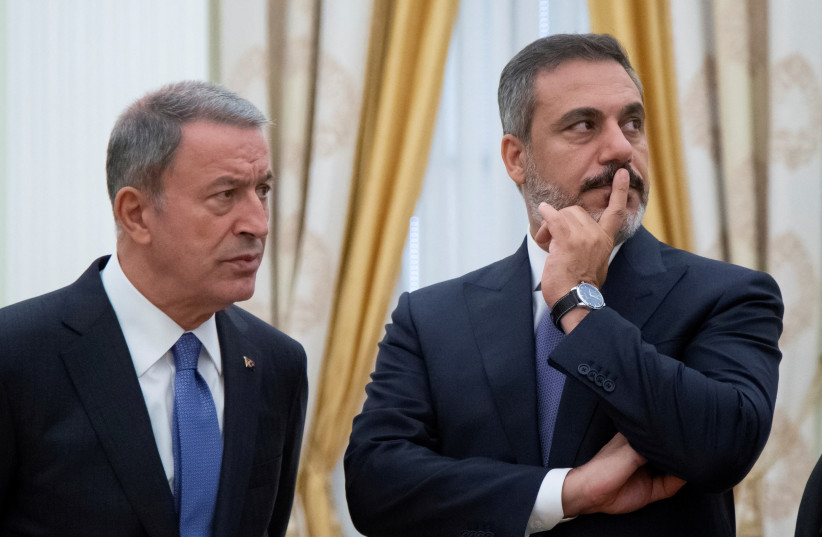 Turkish Defense Minister Hulusi Akar and intelligence chief Hakan Fidan are seen before a meeting with Russian President Vladimir Putin in the Kremlin in Moscow, Russia, August 24, 2018. (credit: Alexander Zemlianichenko/Pool via REUTERS/File Photo)