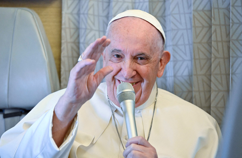 Pope Francis answers reporters questions during a conference aboard the papal plane on his flight back to Rome after visiting Nur-Sultan, Kazakhstan, 15 September 2022. (photo credit: ALESSANDRO DI MEO/POOL VIA REUTERS)