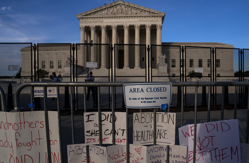  Signs left by abortion rights supporters line the security fence surrounding the Supreme Court in Washington, D.C., June 28, 2022.  (photo credit: Nathan Howard/ Getty Images)