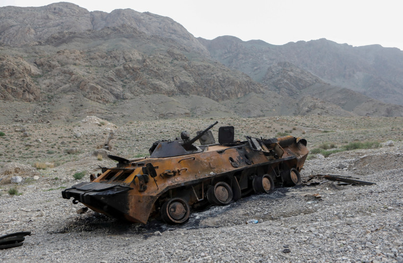  A view shows a burnt armored personnel carrier of Kyrgyz forces near Golovnoi water distribution facility outside the village of Kok-Tash in Batken province, Kyrgyzstan May 5, 2021.  (photo credit: Vladimir Pirogov/REUTERS)