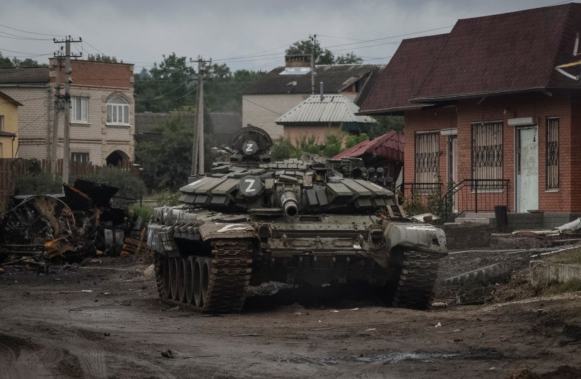  A destroyed Russian tank is seen, as Russia's attack on Ukraine continues, in the town of Izium, recently liberated by Ukrainian Armed Forces, in Kharkiv region, Ukraine September 14, 2022.  (photo credit: GLEB GARANICH/REUTERS)