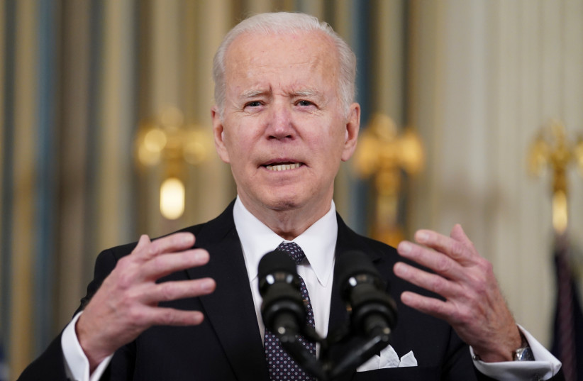 US President Joe Biden responds to a question about Ukraine during an event to announce his budget proposal for fiscal year 2023, in the State Dining Room at the White House in Washington, US, March 28, 2022. (photo credit: REUTERS/KEVIN LAMARQUE)