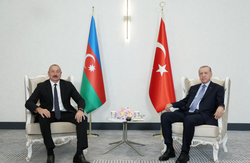 Azerbaijan's President Aliyev meets with Turkish President Erdogan in Samarkand, September 15, 2022. (photo credit: MURAT CETINMUHURDAR/PRESIDENTIAL PRESS OFFICE/HANDOUT VIA REUTERS)