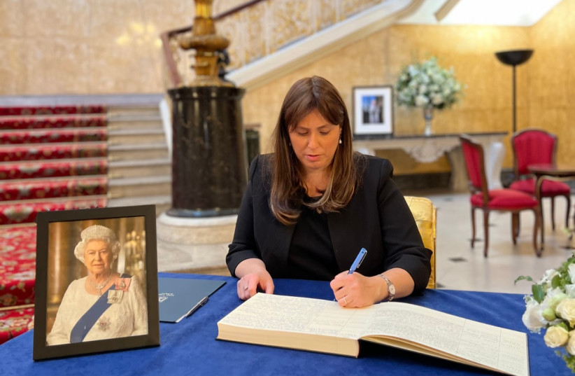  Israeli Ambassador to the UK Tzipi Hotovely writes an entry in a book of condolences for the passing of Queen Elizabeth II. (credit: ISRAELI EMBASSY IN LONDON)