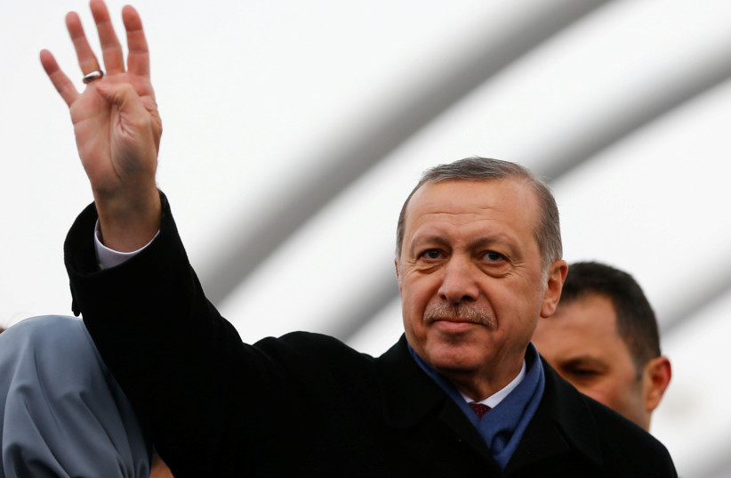  Turkish President Tayyip Erdogan greets people during the opening ceremony of Eurasia Tunnel in Istanbul, Turkey, December 20, 2016.  (credit: REUTERS/MURAD SEZER)