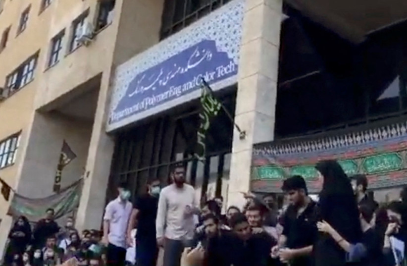 People protest outside Tehran's Amirkabir University of Technology following death of a woman in custody, in Tehran, Iran September 19, 2022 in this still image taken from a video obtained by Reuters. (photo credit: REUTERS)