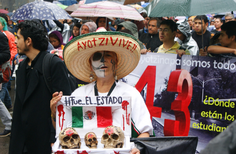 Demonstration on September 26, 2015, on the first anniversary of the Iguala mass kidnapping (credit: PETROHSW/CC BY-SA 4.0 (https://creativecommons.org/licenses/by-sa/4.0)/VIA WIKIMEDIA COMMONS)