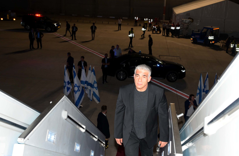  Israeli Prime Minister Yair Lapid is seen heading to New York for the opening of the UN General Assembly, on September 19, 2022. (photo credit: Avi Ohayon/GPO)