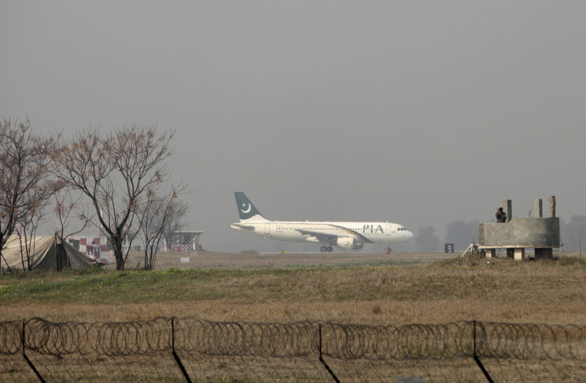  A Pakistan International Airlines (PIA) passenger plane prepares to take off from the Benazir International airport in Islamabad, Pakistan, February 9, 2016.  (photo credit: REUTERS/FAISAL MAHMOOD/FILE PHOTO)