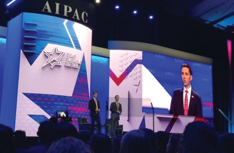  THE WRITER (right, and on the screen) and fellow activist David Huff speak at the 2020 AIPAC Policy Conference in Washington.  (photo credit: Rosie Wilson)
