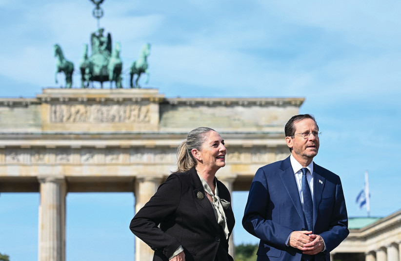  Israel's President Isaac Herzog and First Lady Michal Herzog: The diplomatic and unifying presidential couple. (photo credit: TOBIAS SCHWARTZ/AFP VIA GETTY IMAGES)