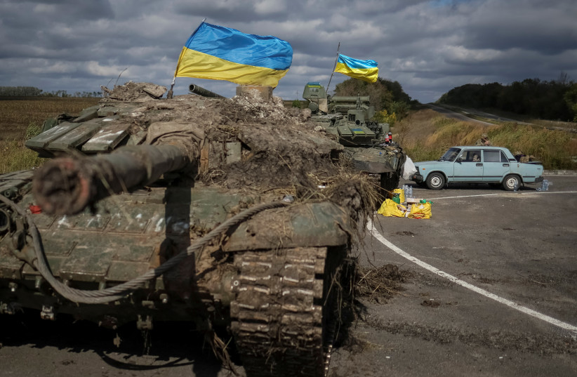 A view shows captured Russian tanks with installed Ukrainian flags, as Russia's attack on Ukraine continues, near the town of Izium, recently liberated by Ukrainian Armed Forces, in Kharkiv region, Ukraine September 19, 2022. (credit: GLEB GARANICH/REUTERS)