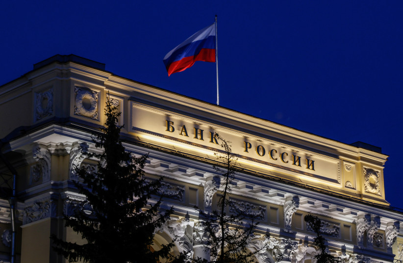 National flag flies over the Russian Central Bank headquarters in Moscow, Russia May 27, 2022. (photo credit: REUTERS/MAXIM SHEMETOV)