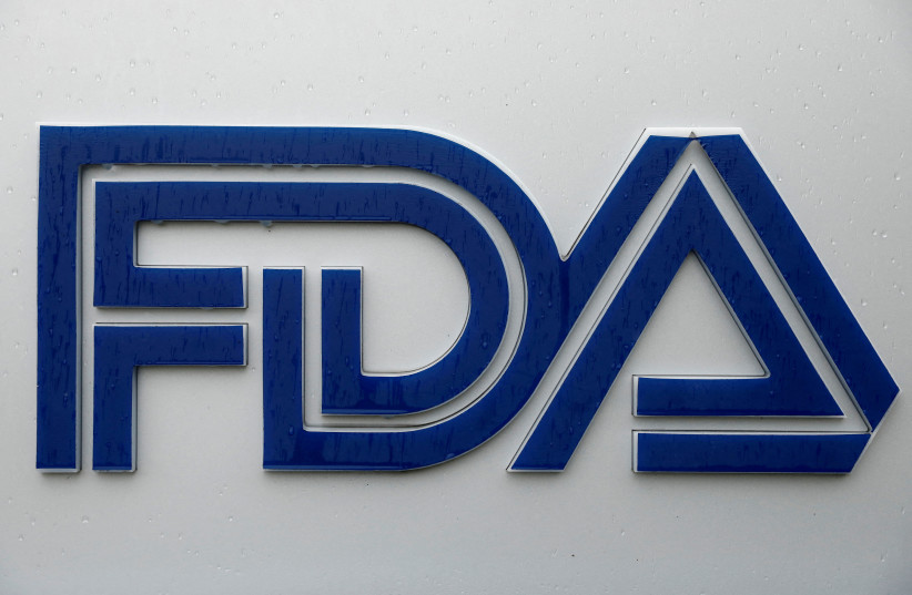 Signage is seen outside of the Food and Drug Administration (FDA) headquarters in White Oak, Maryland, US, August 29, 2020. (photo credit: REUTERS/ANDREW KELLY/FILE PHOTO)