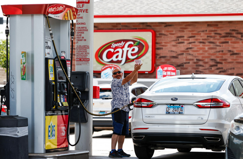 A customer shows his purchased lottery tickets outside the Speedway gas station, where the winning ticket for the Mega Millions lottery jackpot was sold, in Des Plaines, Illinois, US, July 30, 2022. (photo credit: REUTERS/KAMIL KRZACZYNSKI)