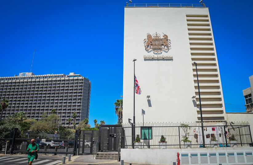  The Union Jack, the national flag of the United Kingdom, hangs at half-mast at the entrance to the British embassy in Tel Aviv on September 9, 2022 (photo credit: AVSHALOM SASSONI/FLASH90)