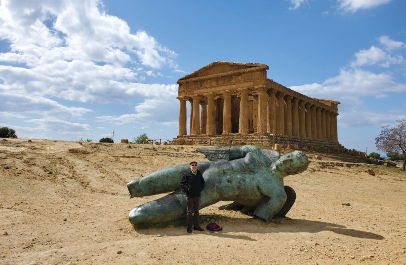  THE WRITER stands strategically in front of  a modern statue of Icarus and the ancient Temple of Concordia. (credit: Itiel Schnitzer)
