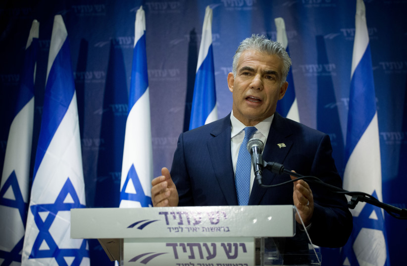  Leader of the Yesh Atid political party Yair Lapid leads a press conference in Tel Aviv (credit: MIRIAM ALSTER/FLASH90)