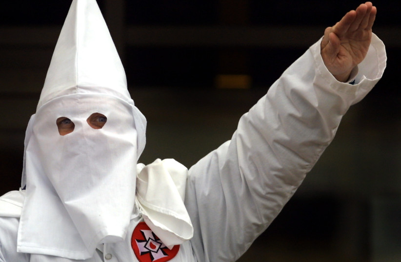  KKK KLANSMAN – America isn’t the only place with a supremacy problem.  (photo credit: Tim Boyle/Newsmakers)