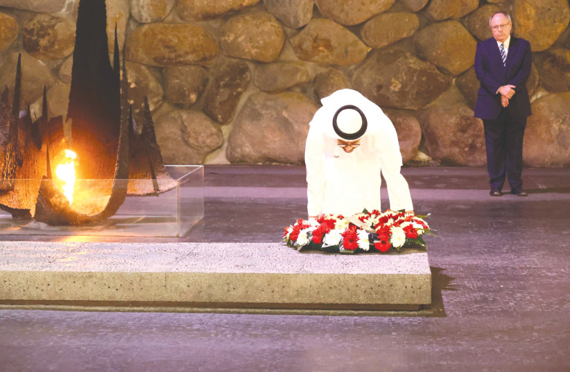  UAE FOREIGN MINISTER SHEIKH ABDULLAH BIN ZAYED AL NAHYAN lays a wreath in the Hall of Remembrance at Yad Vashem during a memorial ceremony commemorating the six million Jewish men, women and children murdered during the Holocaust. (photo credit: Yad Vashem/Miri Shimonovich)