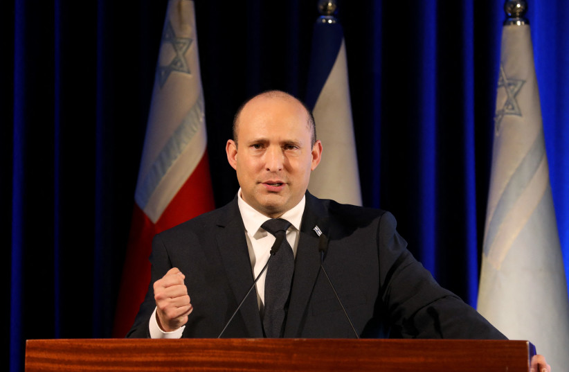  Naftali Bennett gives a speech during a ceremony for the Jewish holiday of Hanukkah in November 2021. (photo credit: GIL COHEN-MAGEN/AFP VIA GETTY IMAGES)