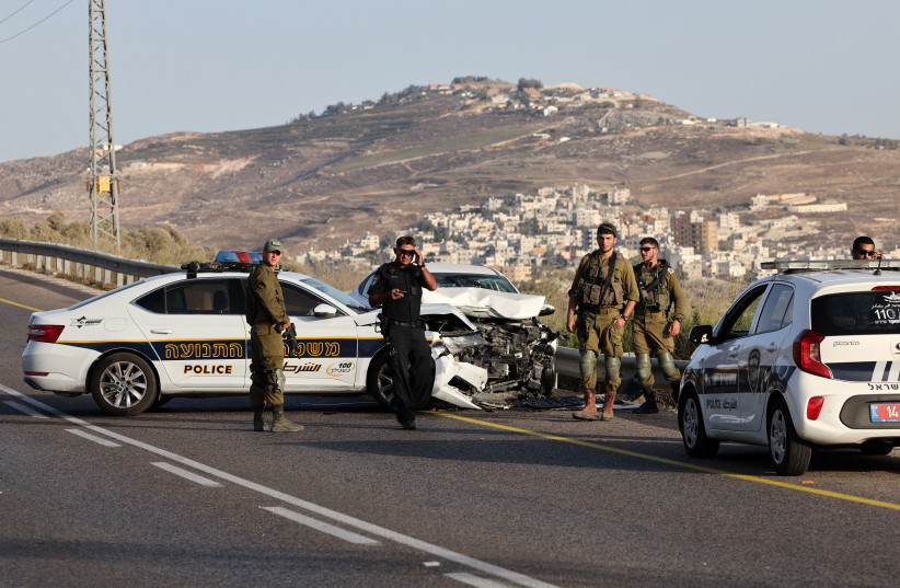  Israeli security forces at the scene of a suspected ramming attack against a group of soldiers patrolling near West Bank city of Nablus, on September 24, 2022 (photo credit: Ahmad Gharabli/AFP via Getty Images)