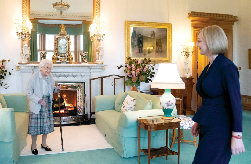  Queen Elizabeth II welcomes Liz Truss at Balmoral Castle in Scotland on September 6.  (credit: JANE BARLOW/POOL/REUTERS)
