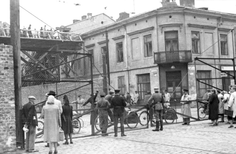  A section of Żelazna Street connecting the ‘large ghetto’ and ‘small ghetto’ areas in Nazi-occupied Warsaw. (credit: WIKIPEDIA)