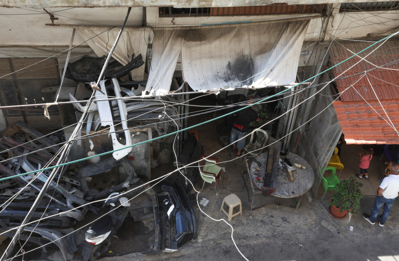  Electricity cables are seen near shops at Tripoli's impoverished Bab al-Ramel neighbourhood (credit: REUTERS)