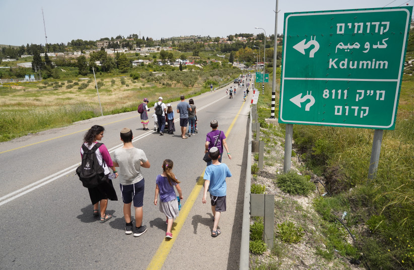  Jewish Israeli settlers take part in the Faith March, held in memory of Israelis killed in terror attacks, near the Jewish settlement of Kedumim, in Samaria, West Bank, on April 25, 2019. (photo credit: HILLEL MAEIR/FLASH90)