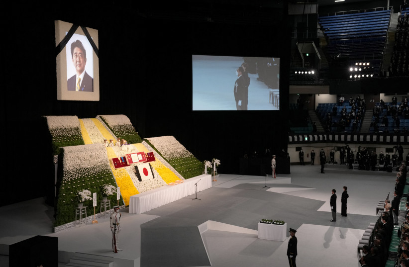  Japan's Prime Minister Fumio Kishida and Akie Abe, widow of former Prime Minister of Japan Shinzo Abe look as Abe’s remain is placed during the state funeral of assassinated former Prime Minister of Japan Shinzo Abe Tuesday Sept. 27, 2022. (photo credit: EUGENE HOSHIKO/POOL - REUTERS)