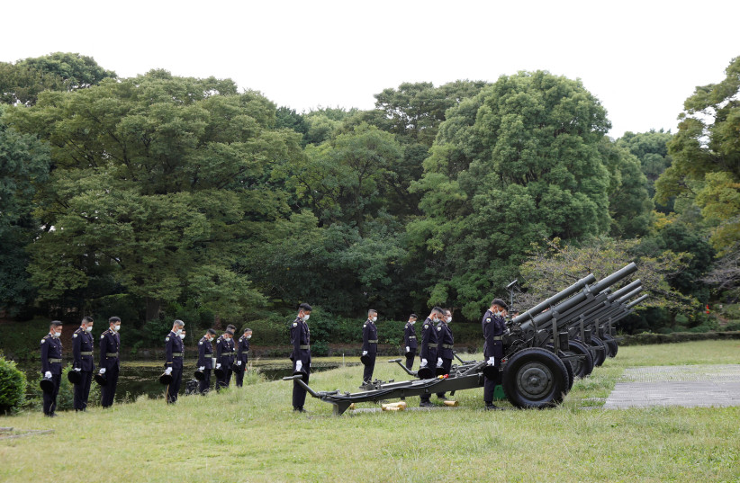  Japanese Ground Self-Defense Force personnel takes a moment of silence after firing cannons at the Budokan grounds for the State Funeral of former Prime Minister Shinzo Abe, on September 27, 2022. (credit:  Rodrigo Reyes Marin/Pool via REUTERS)