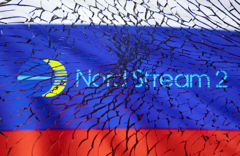 Nord Stream 2 logo and Russian flag are seen through broken glass in this illustration taken March 1, 2022.  (photo credit: REUTERS/DADO RUVIC/ILLUSTRATION)