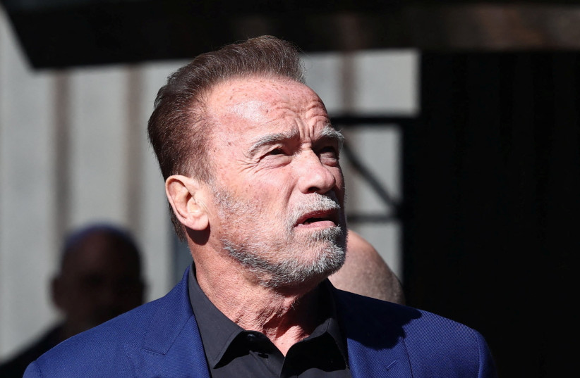 Actor and former California Governor Arnold Schwarzenegger visits former Nazi German concentration camp Auschwitz-Birkenau, near Oswiecim, Poland, September 28, 2022. (credit: JAKUB PORZYCKI/AGENCJA GAZETA VIA REUTERS)