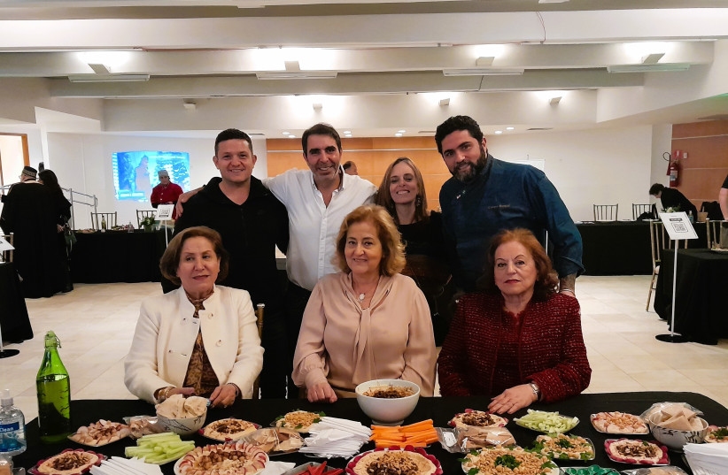  A team of three Christian Arab Brazilians, seated in front, won first place at the inaugural Abrahamic Hummus Championship in Sao Paulo, Brazil, Sept. 21, 2022 (photo credit: Hebraica Sao Paulo)