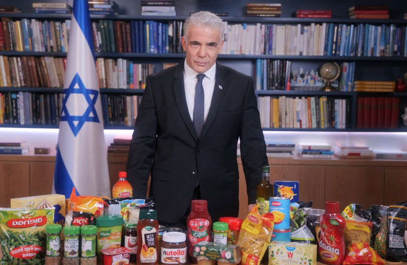 Prime Minister Yair Lapid looming over several staple Israeli food brands (credit: PRIME MINISTER'S OFFICE)