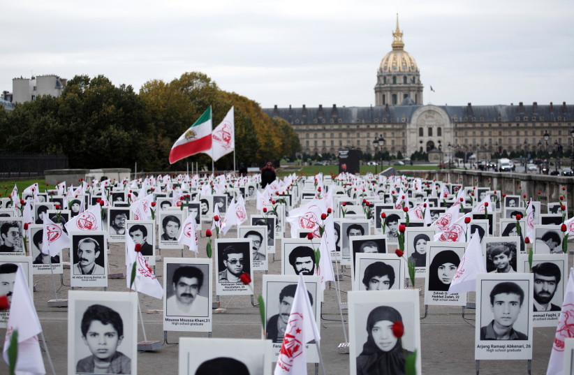  MEMORIAL EXHIBITION features Iranian political prisoners on the Esplanade des Invalides in Paris, 2019.  (credit: BENOIT TESSIER/REUTERS)