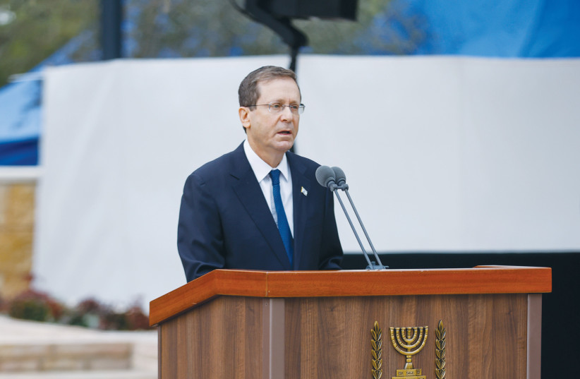  PRESIDENT ISAAC Herzog speaks, in January, at the funeral of his mother Aura Herzog, buried alongside her husband Chaim Herzog, who served as president 1983-1993, at Mount Herzl cemetery in Jerusalem. Yaacov Herzog was the brother and uncle respectively of the two presidents. (photo credit: OLIVIER FITOUSSI/FLASH90)