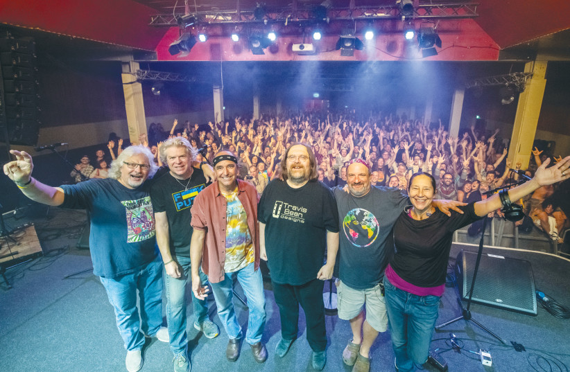  THE DARK STAR ORCHESTRA poses with its fans at the end of its Berlin show, last week.  (photo credit: Bob Minkin Photography/minkinphotographystore.com)