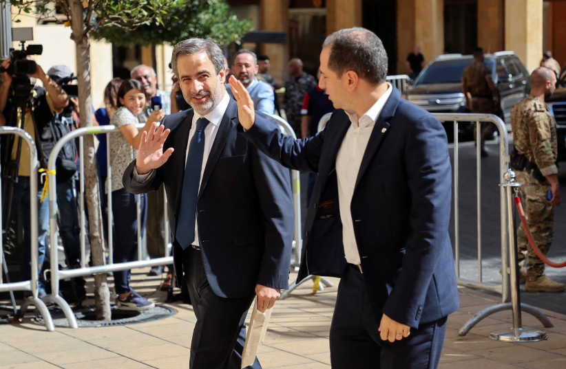  Lebanese MPs Michel Moawad and Sami Gemayel gesture upon arrival to attend the first session to elect a new president, outside the parliament building in Beirut, Lebanon September 29, 2022 (credit: REUTERS/MOHAMED AZAKIR)