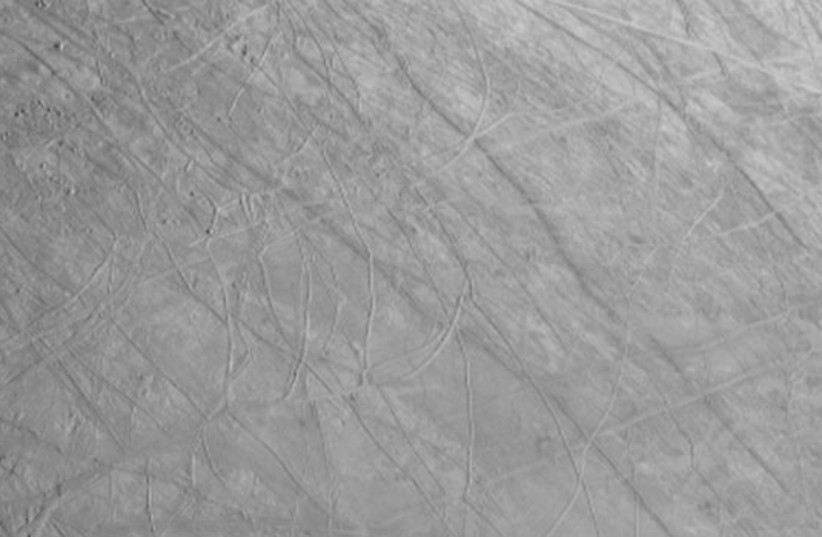  A new picture of Jupiter's moon Europa was shared by NASA's Juno spacecraft in its recent close approach to the moon on Thursday. (photo credit: NASA/JPL-Caltech/SWRI/MSSS)