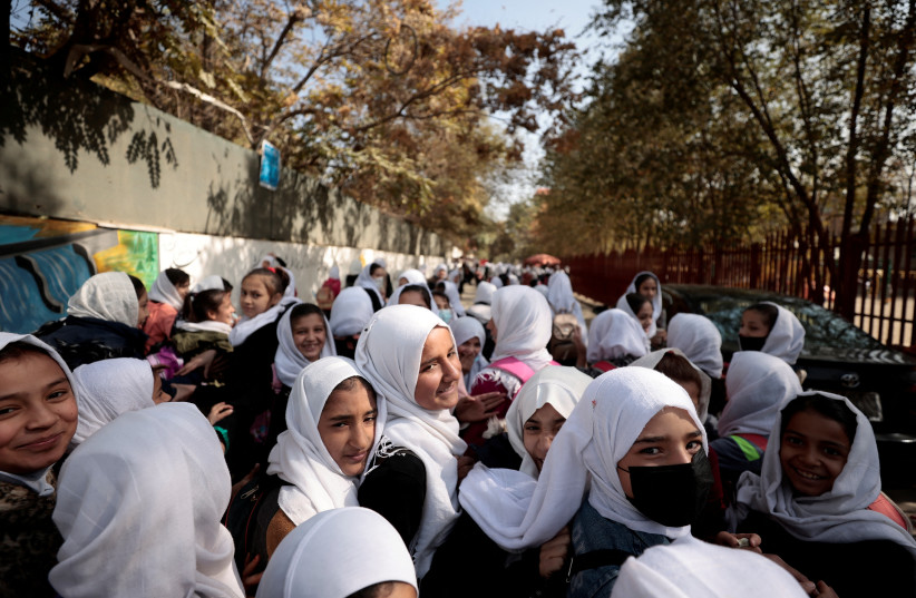  Female primary school students leave school after a class in Kabul, Afghanistan, October 25, 2021 (photo credit: REUTERS/ZOHRA BENSEMRA)