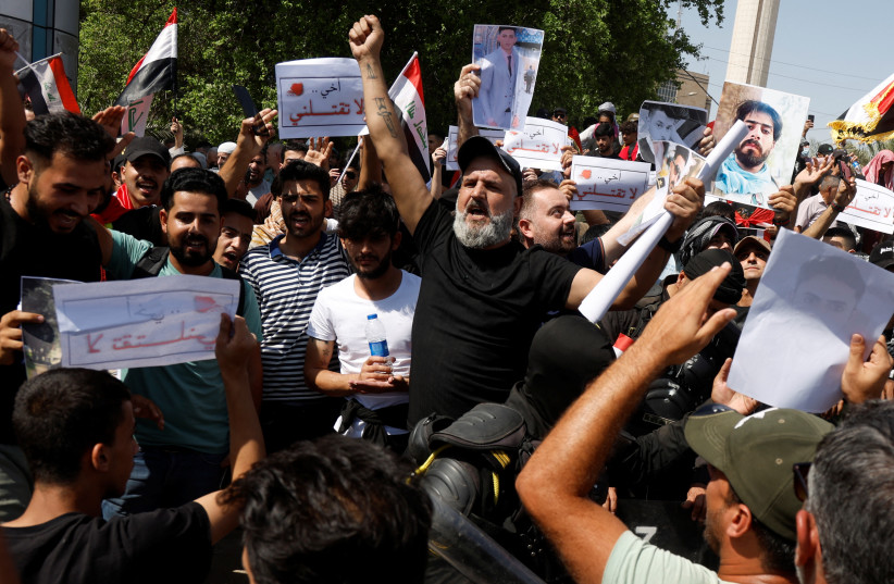  Protestors gather to mark the third anniversary of the anti-government protests in Baghdad (credit: REUTERS)